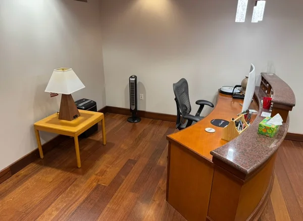 Reception desk assembled and arranged with the surrounding floor clear